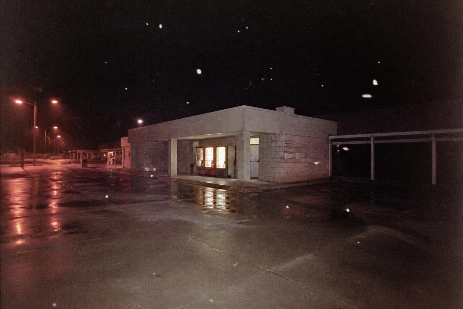 THE HIGHWAY REST STOP — Between two places, at night.